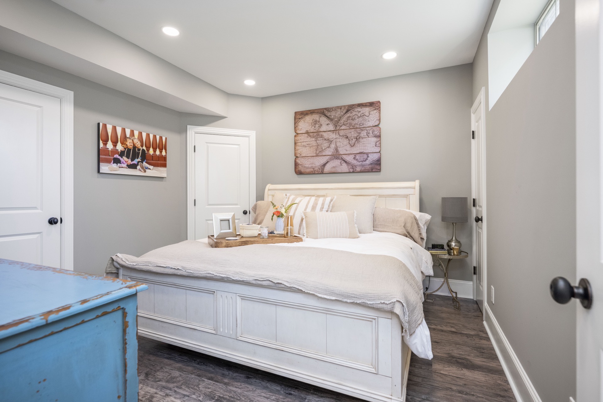 Finished basement guest bedroom with recessed lighting