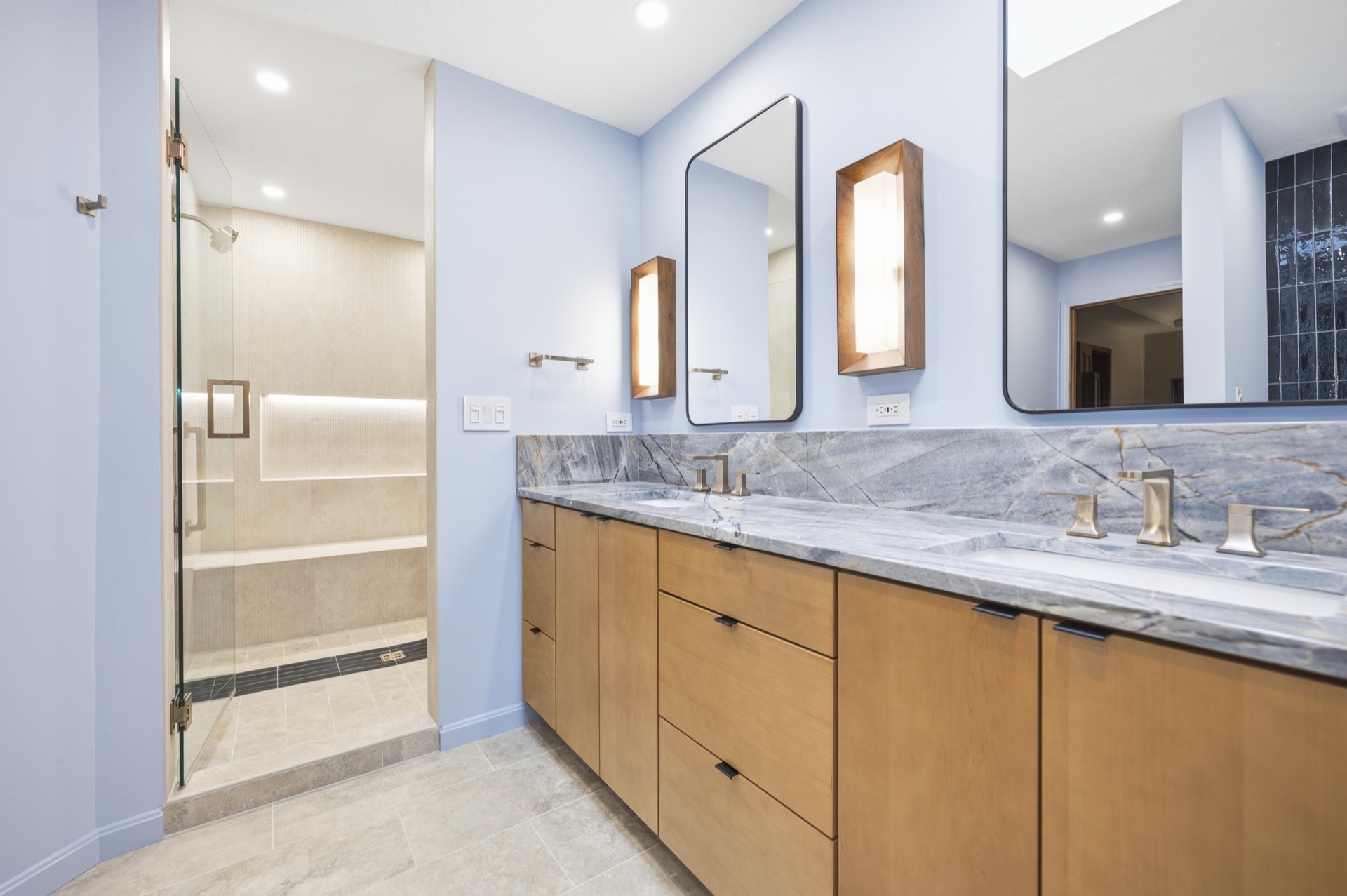 Fox Chase vanity with pale blue walls and glass shower