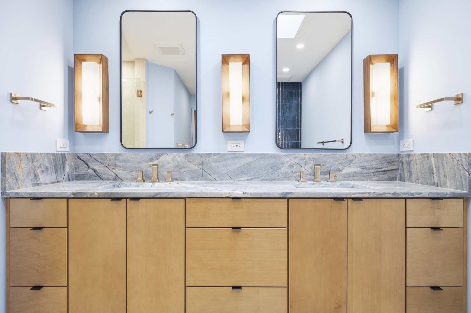 Fox Chase double vanity with marble countertop and brass faucets