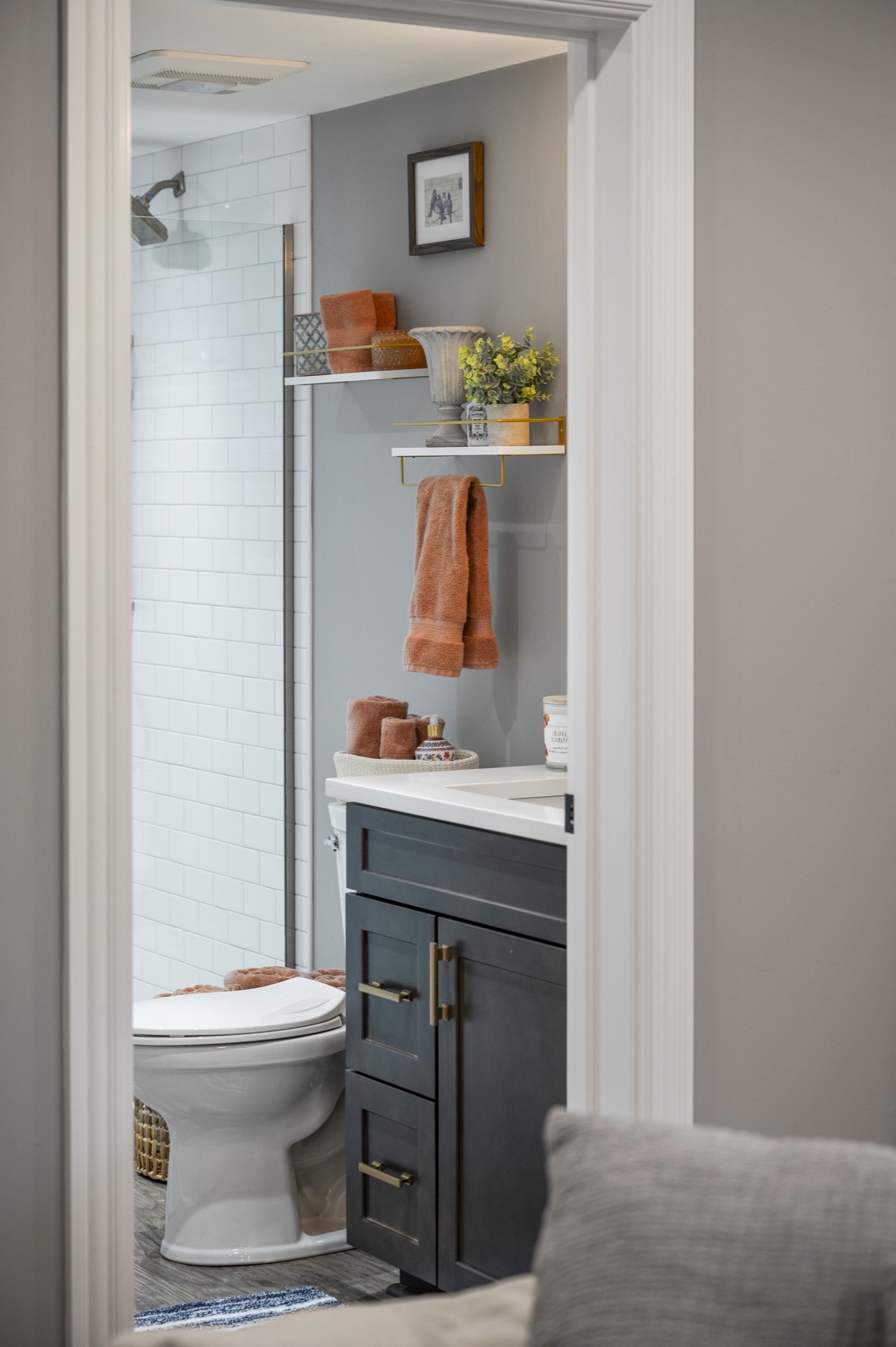 A guest bath with gold accents and a glass shower — bathroom renovation in Lexington, KY