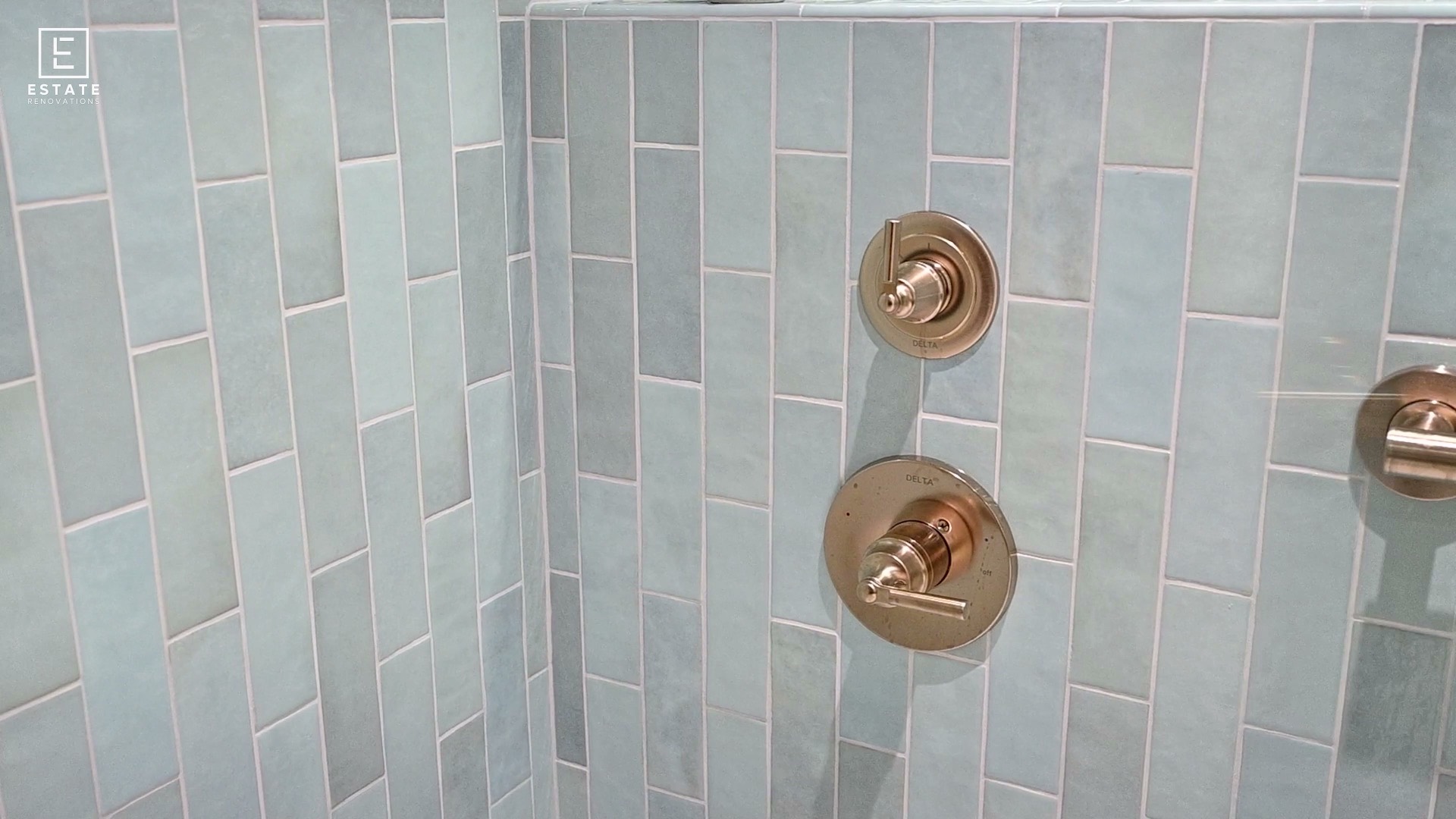 Seafoam tile and brushed brass in a compact bath — bathroom renovation in Lexington, KY