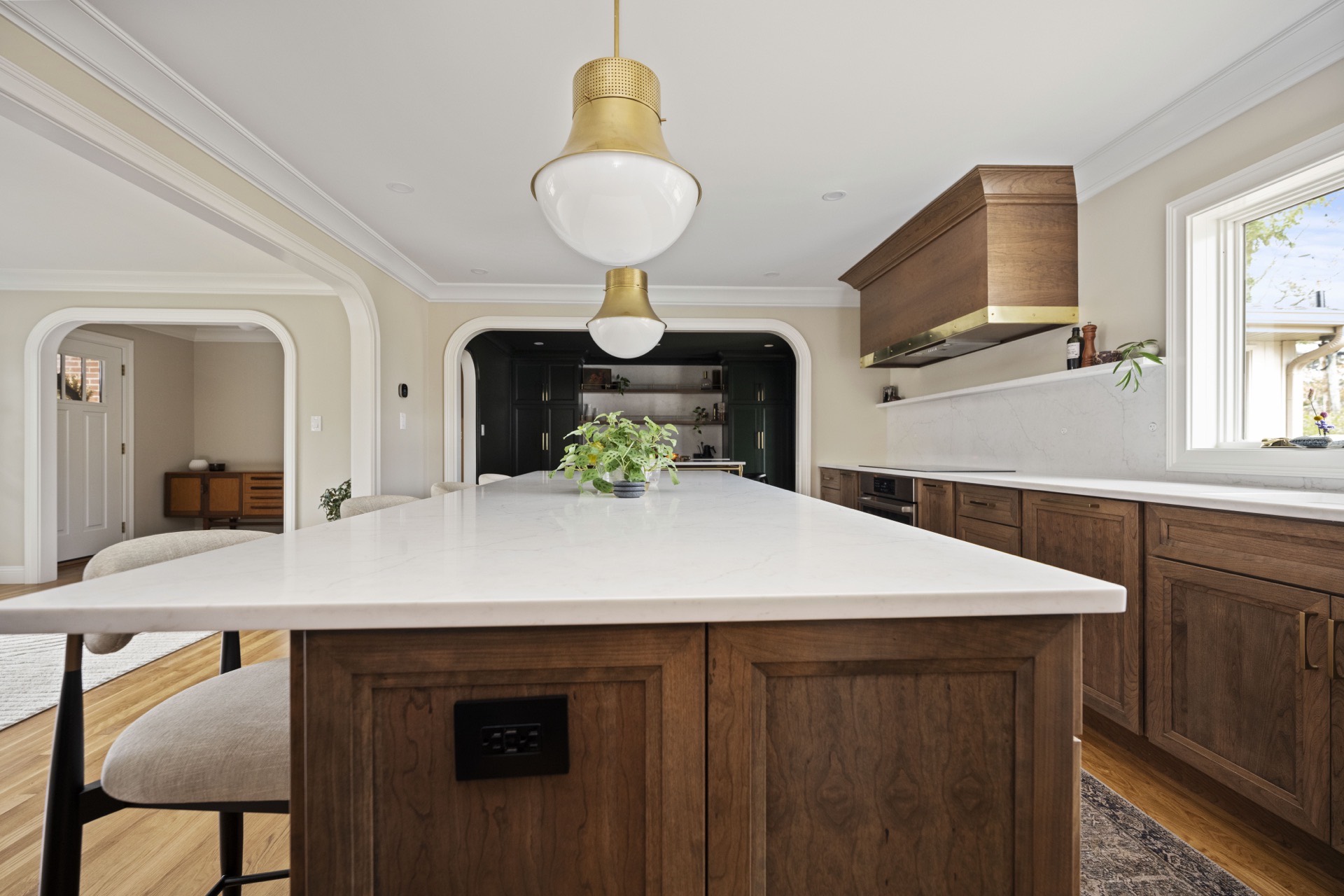 Athenia kitchen looking toward arched openings and pantry