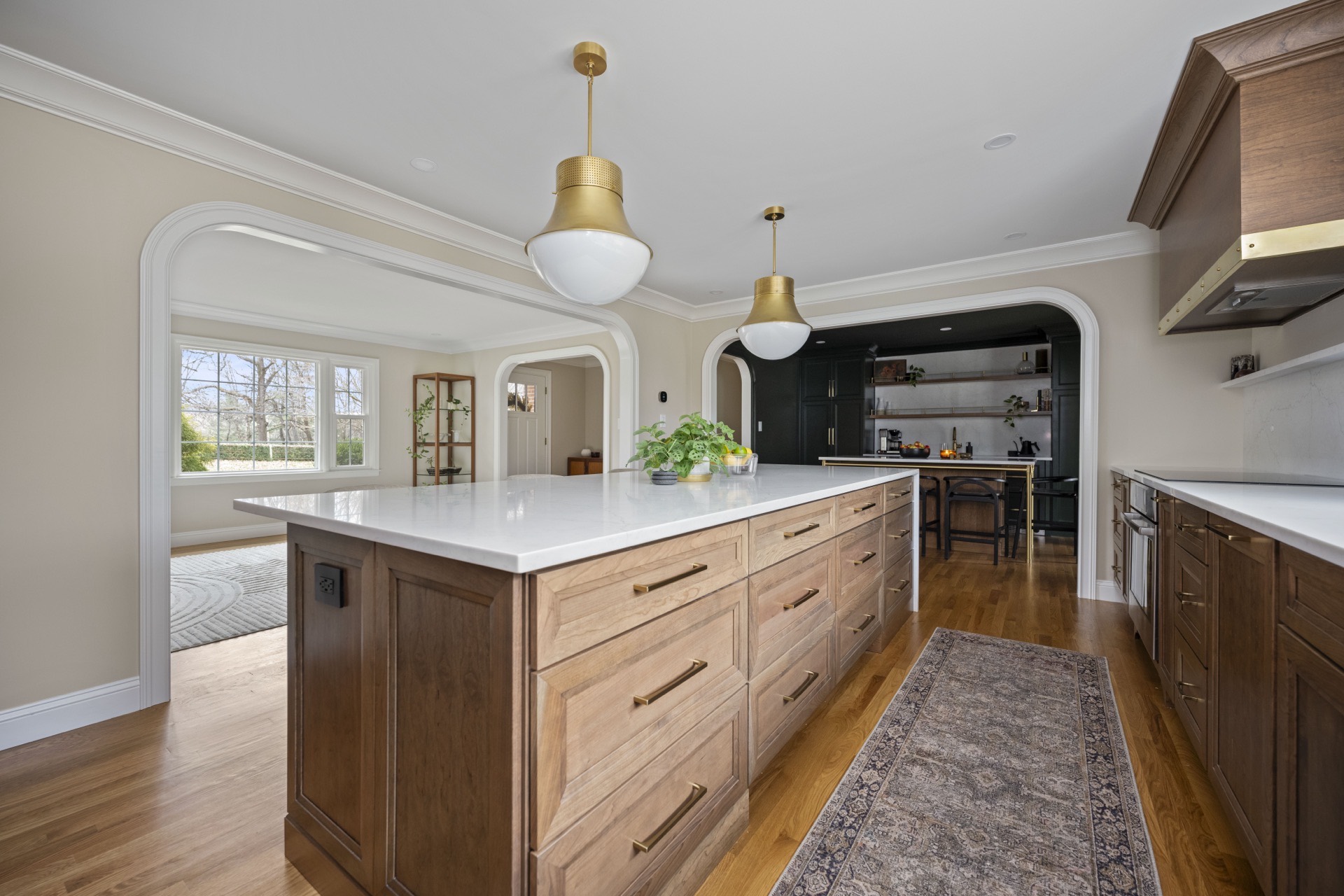 Open view through the Athenia kitchen toward adjoining rooms