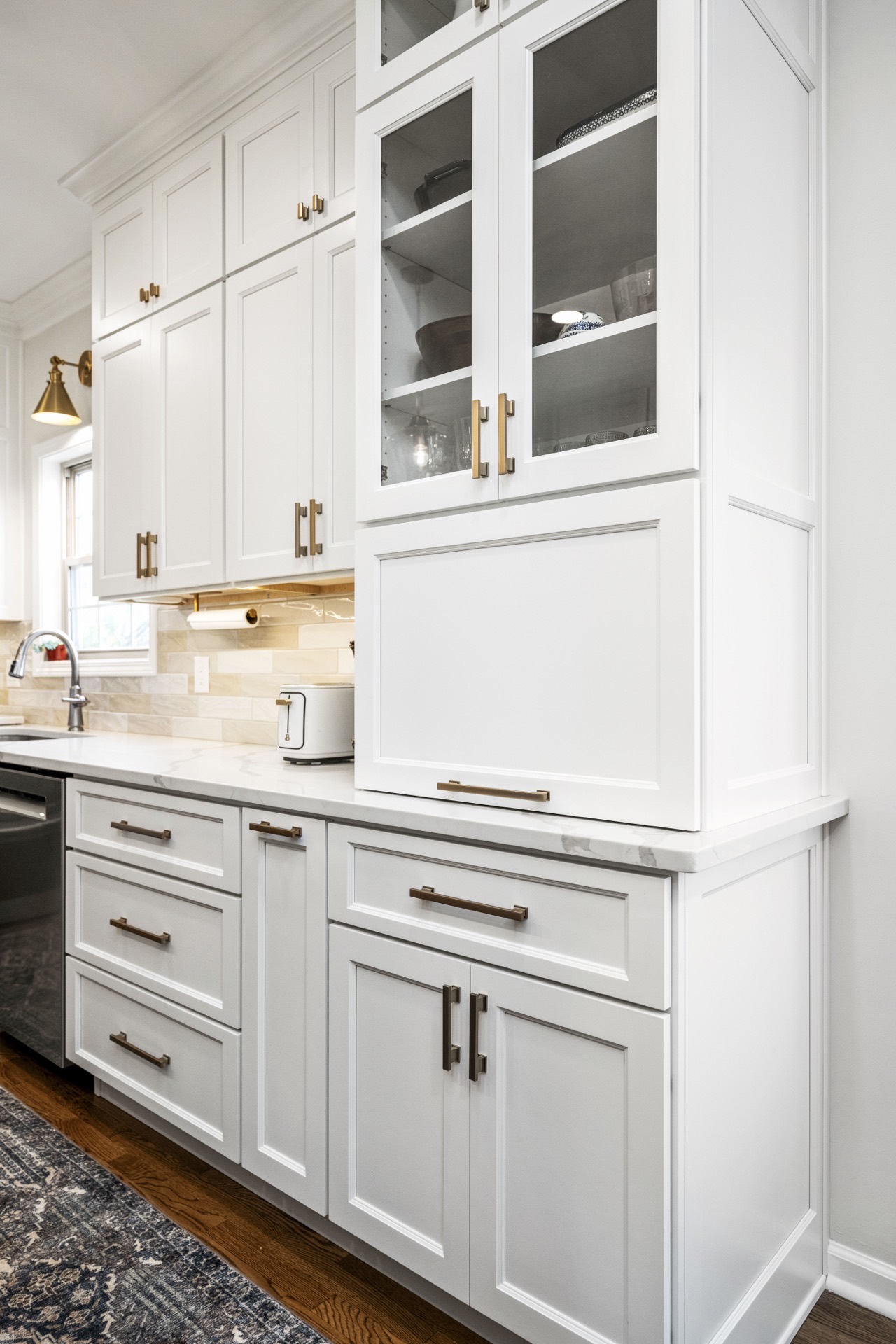 Glass-front cabinets and brass hardware at Ridgewater