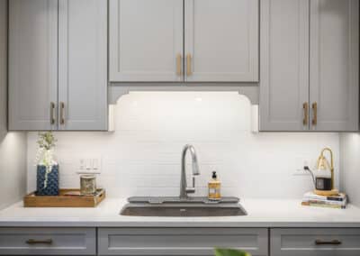 Cozy Retreat Basement Renovation - cabinets, sink