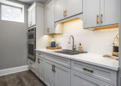 Cozy Retreat Basement Renovation - kitchen cabinets, sink, oven